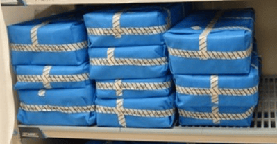 Blue wrapped sets on a shelf